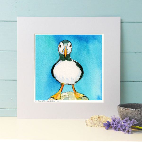 Pot bellied puffin painting with a turquoise blue background.